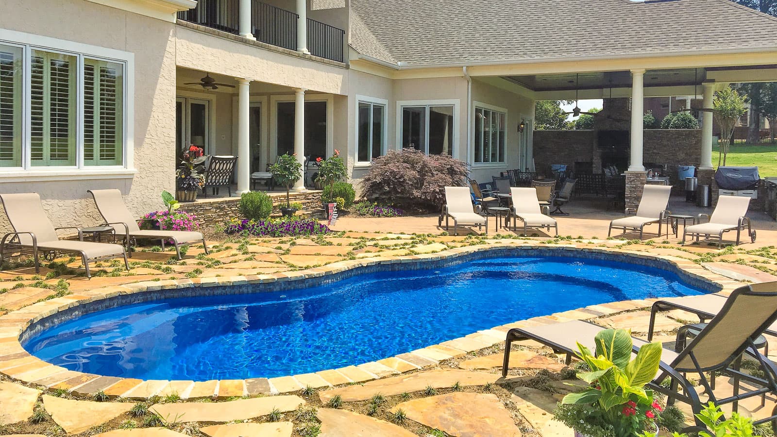 Freeform fiberglass inground pool installation